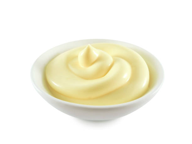 istock Mayonnaise or cream swirl in bowl isolated 1250327963