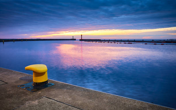 istock Mooring bollard in a harbor during the blue hour. 1250329845