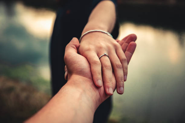 istock Young Couple Holding Hands Follow Me 1250329866