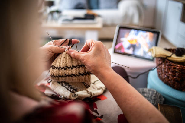 istock An older woman is knitting wool socks 1250332290