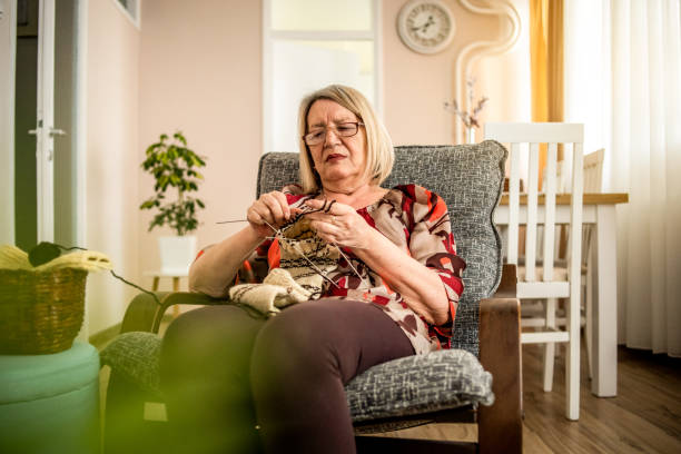 istock An older woman is knitting wool socks 1250332504