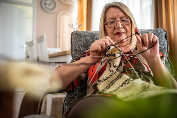 istock An older woman is knitting wool socks 1250332655