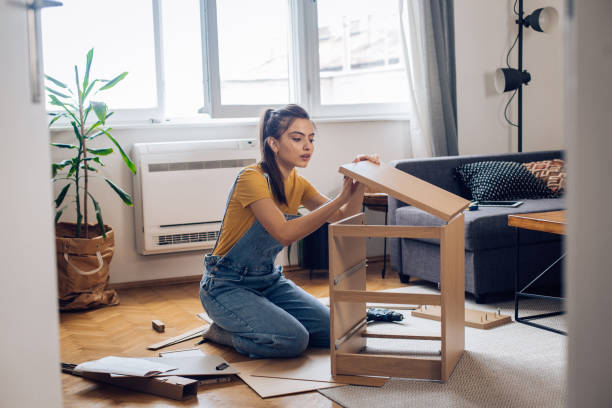 istock Girl is making a DiY shelf at home 1250334229