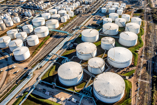 Aerial view of a large group of fuel storage tanks at an east Texas oil refinery located just outside of Houston, Texas.