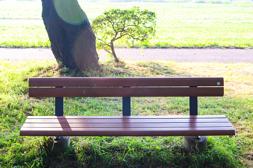 A bench with a mountain and sea view