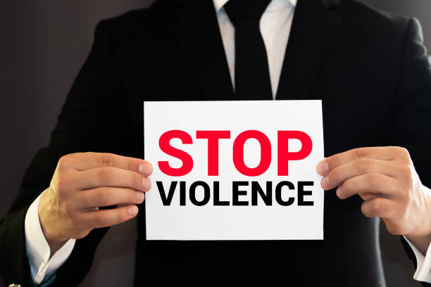 istock Stop Violence stencil print on the grunge brick wall 1250341212