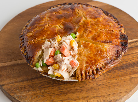 Chicken pot pie. Classic American restaurant or diner favorite. Diced vegetables, celery, beans, chilis, carrots, onions, garlic, sautéed in olive oil & baked in flaky pie crust. American favorite.