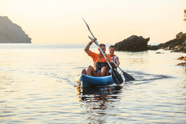 istock Kayakers Paddling Along Mediterranean Coastline at Dawn 1250348469