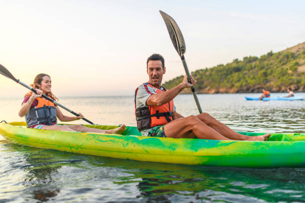 istock Spanish Couple Kayaking Along Mediterranean Shoreline 1250348480