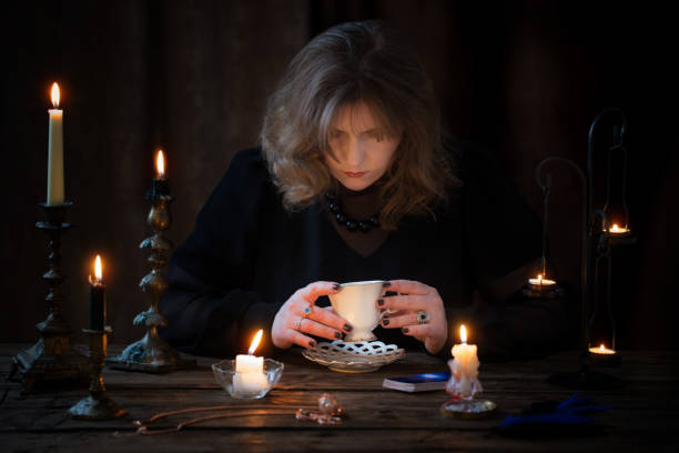 istock mature woman divines on coffee grounds 1250348634