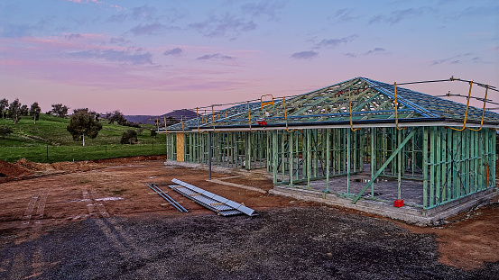 Residential home being built at dusk