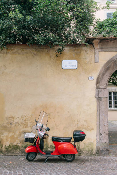 istock Typical Central Italy street with red Vespa 1250353938