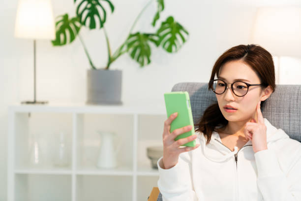 asian woman to see a smart phone,think,