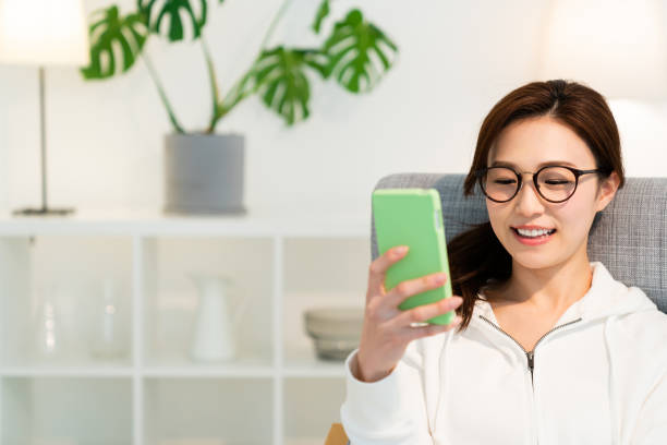 istock asian woman to see a smart phone 1250360607