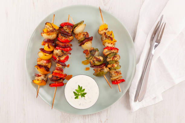 istock Bbq chicken skewers on plate. Top view, flat lay. 1250361124