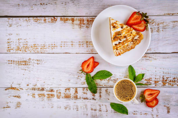 istock Piece of caramel pie with cup of coffee. 1250370324