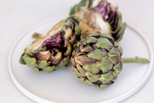 istock Artichokes in a white ceramic plate. 1250371035