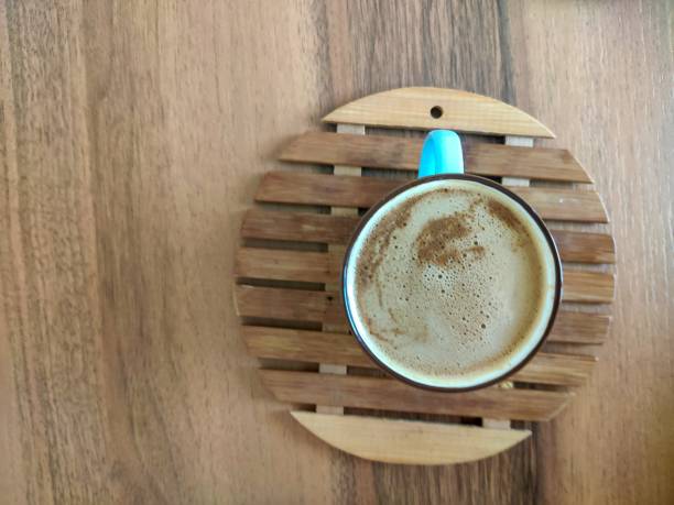 istock coffee cup on wood background 1250373922