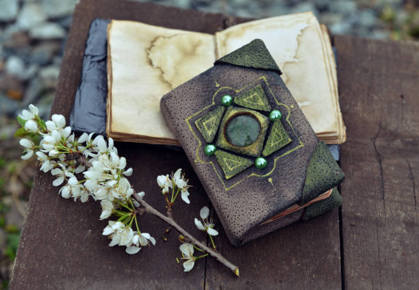 istock Decorated book and open diary with flowers on planks outdoors. 1250376904