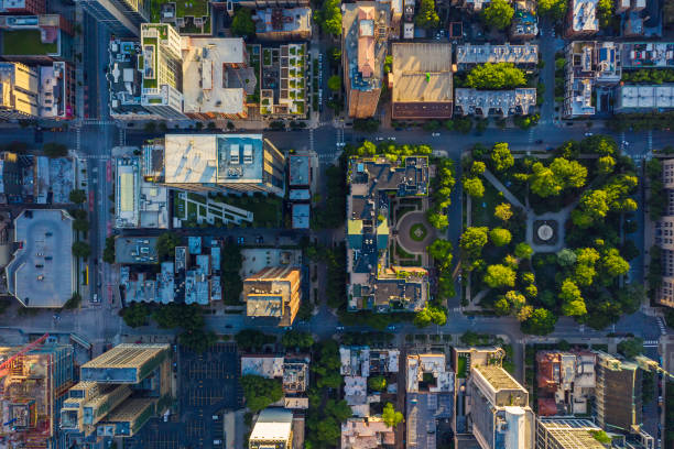 Top down aerial view of Chicago Downtown urban grid with park Top down aerial view of Chicago Downtown urban grid with park. Late afternoon light urban lifestyle stock pictures, royalty-free photos & images