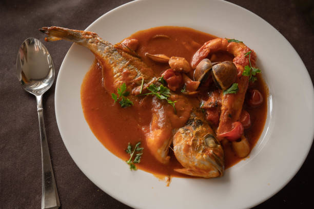 istock neapolitan tomato-based seafood soup and spoon, Campania, Italy 1250381174