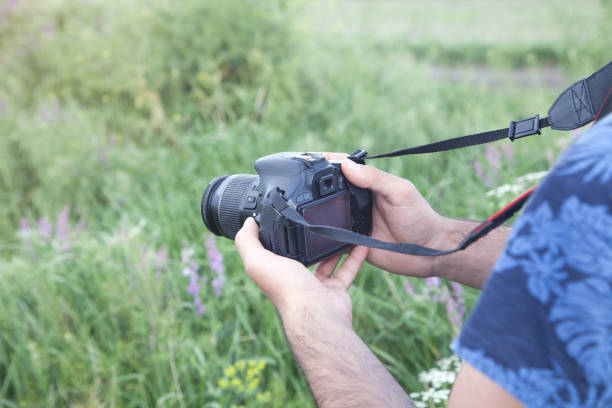 istock Professional photographer taking picture in nature. 1250387457
