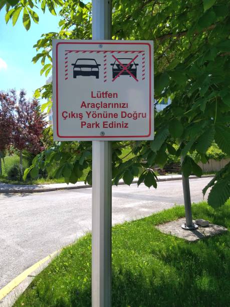 istock Vehicle Parking Direction Sign. Please Park Your Vehicles in the Direction of Exit 1250388271