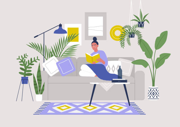 ilustrações de stock, clip art, desenhos animados e ícones de young female character sitting on sofa and reading a book, cozy boho interior with plants and ethnic decoration, stay at home - pillow cushion vector bedding