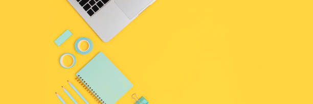 istock Banner with laptop and mint color stationery. 1250390722