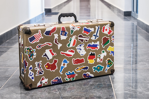 suitcase stickers of the flags of the countries from travels around the world