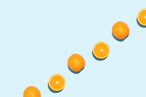 istock Line made of oranges on blue background. 1250394769