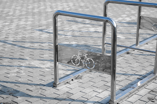 Empty bicycle parking with a sign of bicycle on a street