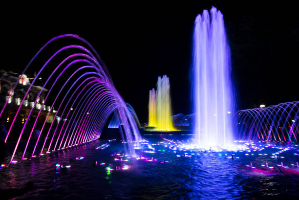 Colored night fountain, Krasnodar city, Russia Fountains in the city. Colored night fountain, Krasnodar city, Russia krasnodar stock pictures, royalty-free photos & images