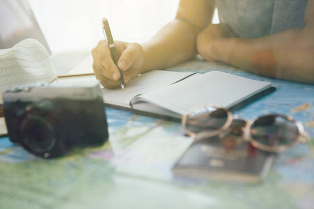 istock Young man planning vacation trip with map,selective focus,flare light 1250399571