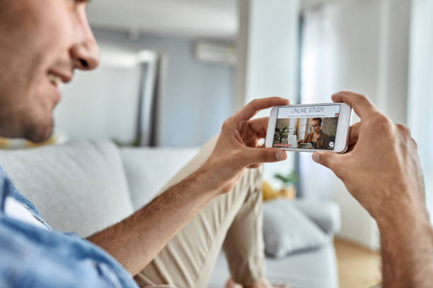 istock Close-up of a man e-learning over smart phone. 1250400832