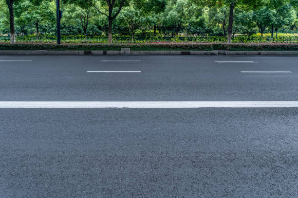 istock Asphalt ground and garden green space 1250402593