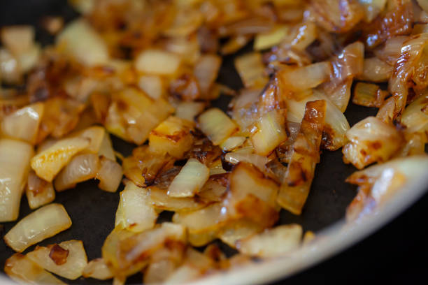 istock Fried onions in a frying pan 1250403876