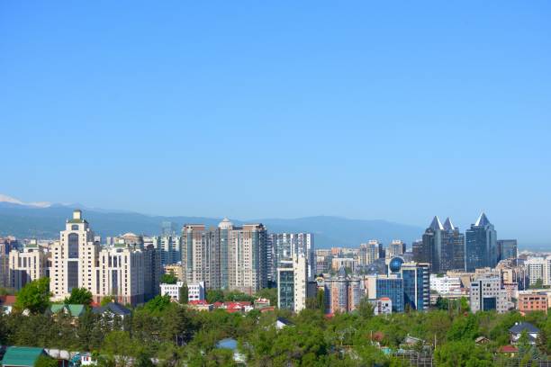 istock Almaty city skyline with mountains 1250404593