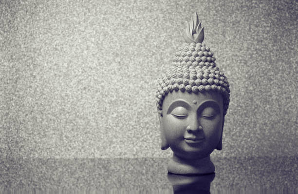 istock Buddha head on gray background and space for text 1250405149