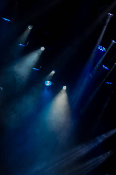 istock lights spotlights and smoke over the stage 1250405673