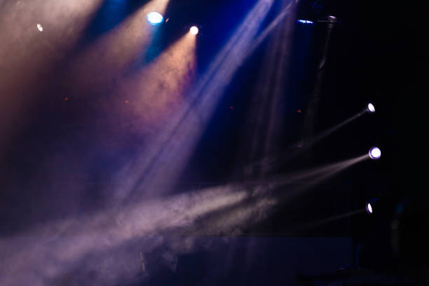 istock lights spotlights and smoke over the stage 1250405729
