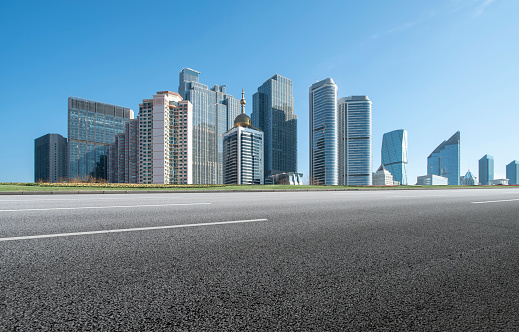 Road surface and urban landscape skyline