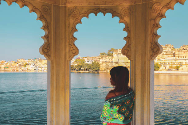 istock woman looking out of arch window 1250406097