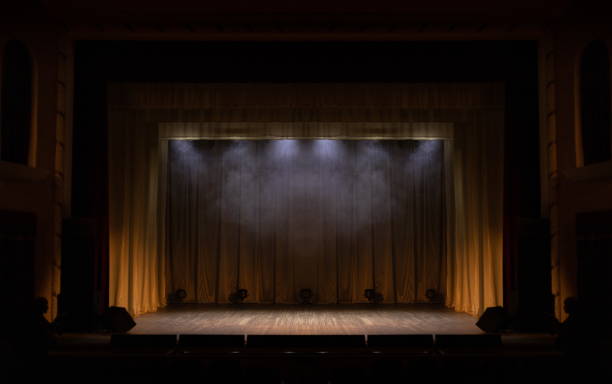 istock Theater lights spotlights and smoke over the stage 1250406799