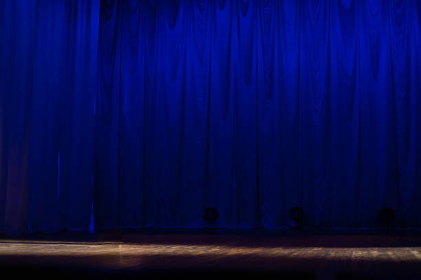 istock Theater lights spotlights and smoke over the stage 1250406896
