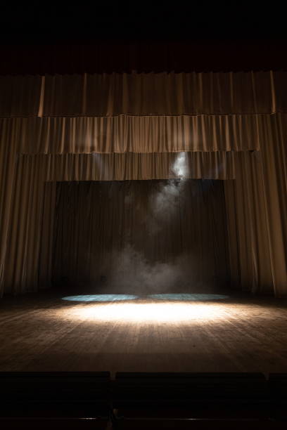 istock Theater lights spotlights and smoke over the stage 1250407016