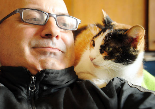 istock Portrait of a Man and his Cat 1250408954
