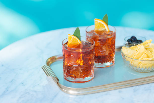 Negroni Cocktail Negroni, an italian cocktail, an apéritif, first mixed in Firenze, Italy, in 1919. Count Camillo Negroni asked to strengthen his Americano by adding gin rather than normal soda water. vermouth stock pictures, royalty-free photos & images