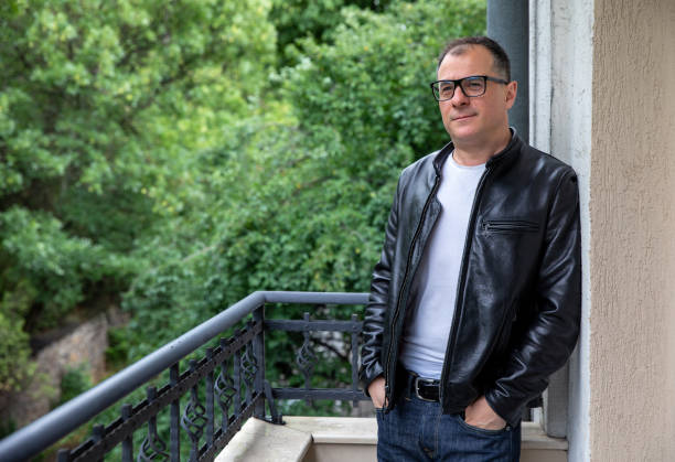 istock Middle aged man relaxing on his balcony 1250413233