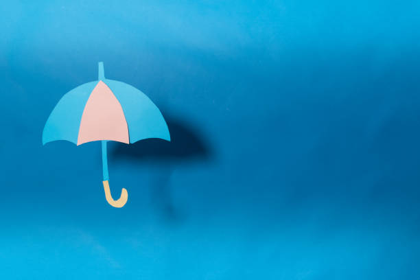 istock Illustrative umbrella and blue background 1250416318